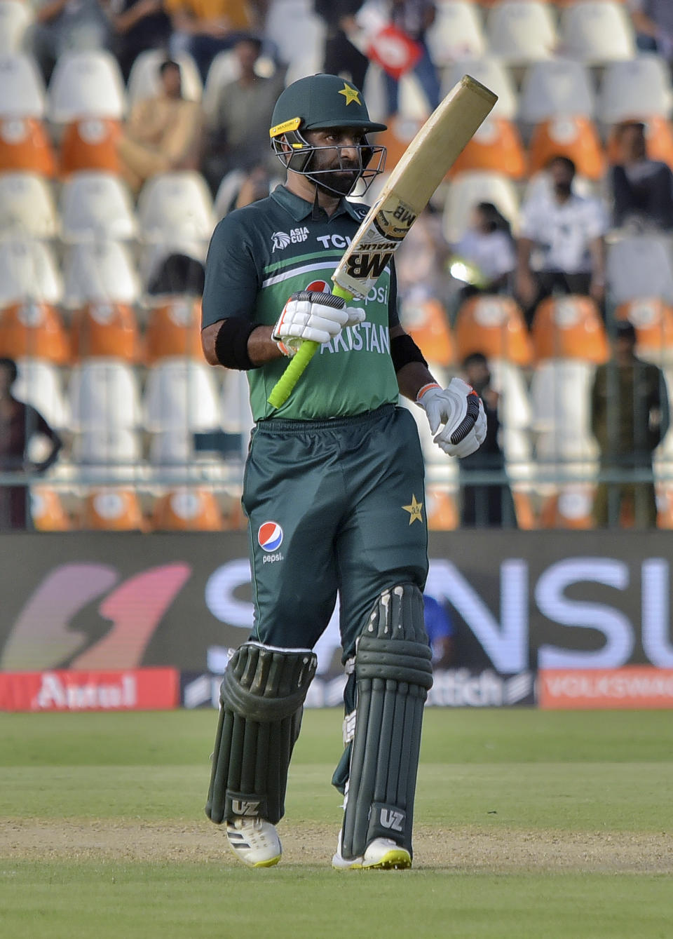 Pakistan's Itikhar Ahmed celebrates after scoring century during the one-day international cricket match of Asia Cup between Pakistan and Nepal, in Multan, Pakistan, Wednesday, Aug. 30, 2023. (AP Photo/Asim Tanveer)