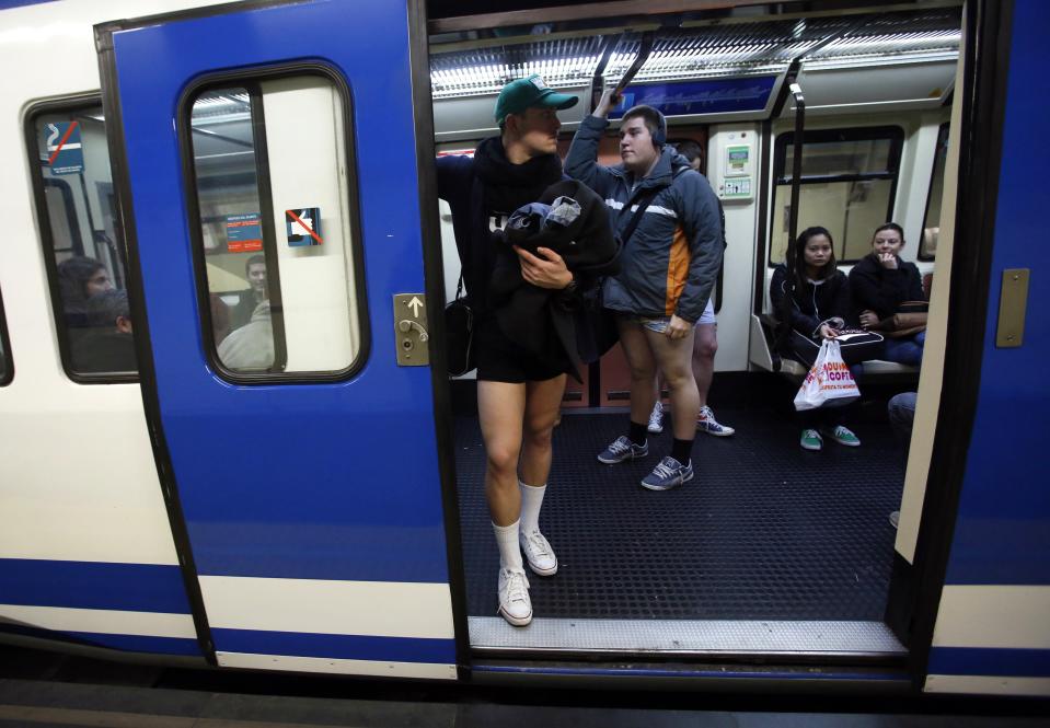 Passengers without their pants stand inside a train during the "No Pants Subway Ride" event at a subway station in Madrid