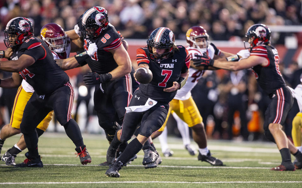 Utah quarterback Cameron Rising (7) hands the ball off the ball against USC on October 15, 2022 Rice-Eccles Stadium in Salt Lake City Utah. (Photo by Chris Gardner/ Getty Images)