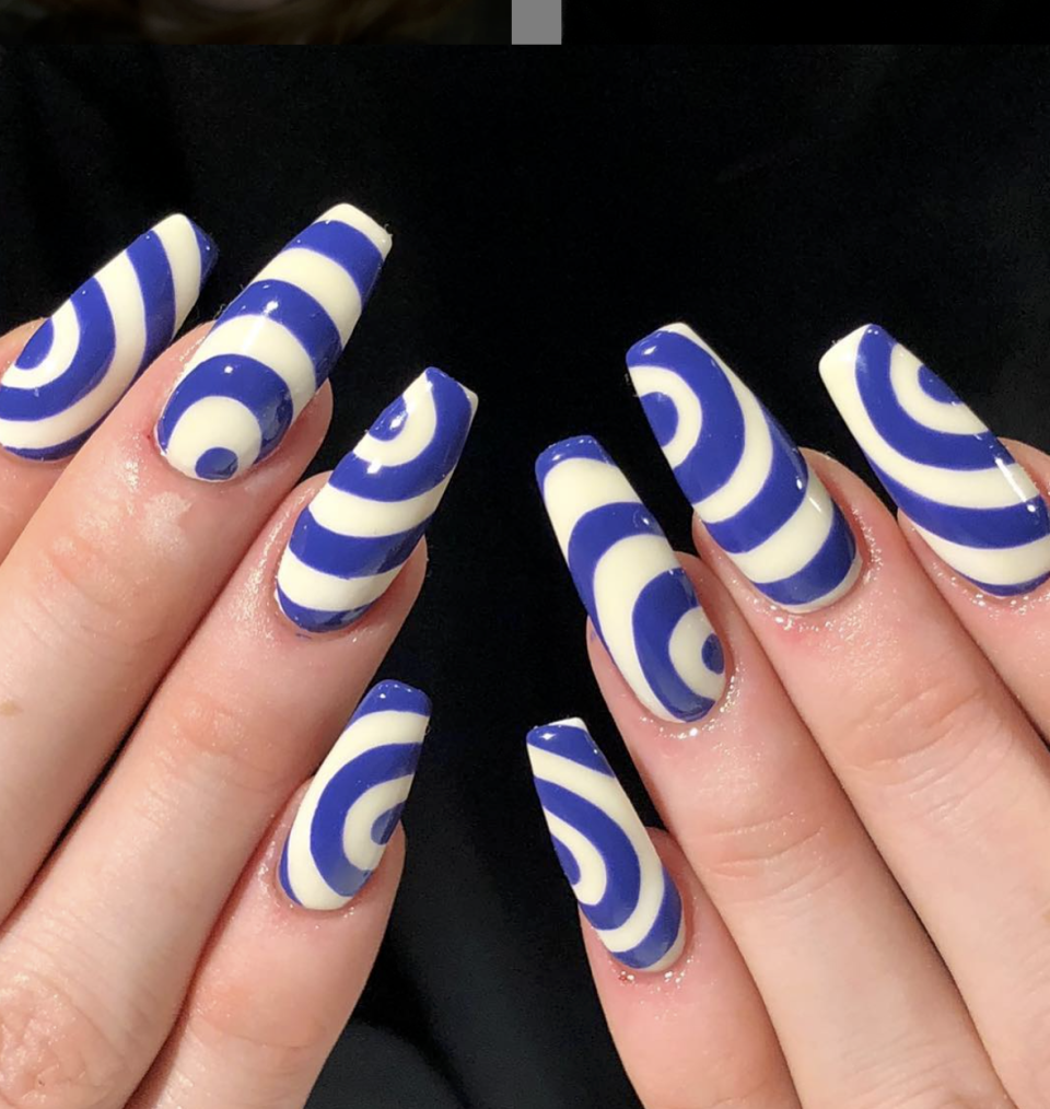 <p>For a more unique twist (literally, look at at those swirls!) try a curvy blue and white design. </p><p><a class="link " href="https://www.amazon.com/PUEEN-Vinyl-Nail-Stencil-09-16/dp/B012V6G6AI/?tag=syn-yahoo-20&ascsubtag=%5Bartid%7C10072.g.27727694%5Bsrc%7Cyahoo-us" rel="nofollow noopener" target="_blank" data-ylk="slk:SHOP STENCIL">SHOP STENCIL</a></p>
