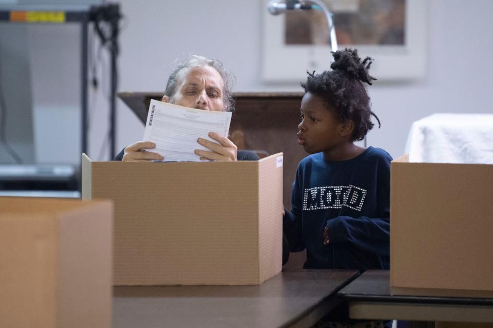 Gary Wolfenbarger is accompanied by daughter Hannah while voting at the local Communication Workers of America facility on Nov. 8, 2022, in Knoxville. This year's city primary will be on Aug. 29. The final day to register to vote before the primary is July 31.