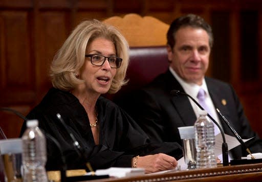 Chief Judge Janet DiFiore speaks at the Court of Appeals after being sworn in by Gov. Andrew Cuomo, right, on Monday, Feb. 8, 2016 (AP Photo/Mike Groll)