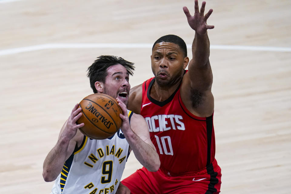 Indiana Pacers guard T.J. McConnell (9) shoots over Houston Rockets guard Eric Gordon (10) during the second quarter of an NBA basketball game in Indianapolis, Wednesday, Jan. 6, 2021. (AP Photo/Michael Conroy)