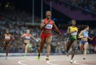 US' Carmelita Jeter wins the women's 4 x 100m relay final at the athletics event of the London 2012 Olympic Games on August 10, 2012 in London