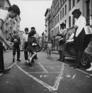 <p><span>Big cities were not filled with parks and green spaces like they are now. Stickball, street hockey, Ringolevio, Marco Polo, and hide-and-seek were just a few of the games that kids played on high-trafficked streets in the '60s. They also </span><span>played with marbles and aimed them into the small holes in manhole covers, and there were hopscotch boards written with chalk on the asphalt. Everyone moved out of the way when cars came and when the cars drove off, games resumed. </span><br></p>