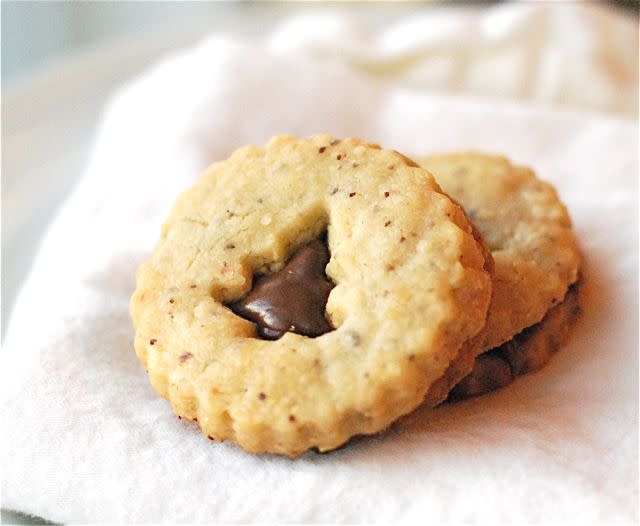 <div class="caption-credit"> Photo by: Kelsey Banfield</div><b>Shortbread and Nutella Sandwich Cookies</b> <br> <b><i>Ingredients:</i></b> <br> 1/3 cup ground hazelnuts, 3 sticks unsalted butter (room temperature), 1 cup granulated sugar, 2 teaspoons vanilla extract, 3 1/2 cups all-purpose flour, pinch kosher salt, 3/4 cup Nutella <br> <b><i>Directions:</i></b> <br> 1. Beat butter and sugar until just combined. Mix the vanilla extract and two tsp of water. <br> 2. Sift together the flour and salt and add it to butter mixture with the mixer on low speed. Stir in ground hazelnuts. Wrap dough in plastic wrap and chill for an hour. <br> 3. Preheat oven to 350F. <br> 4. Roll out chilled dough on a lightly floured surface until 1/8″ thick. Use round cookie cutters to cut out the circles. Use smaller cookie cutters to cut shapes into the tops of the cookies. Place cookies on a lined cookie sheet and chill in the fridge. Bake for 20 to 25 minutes. Cool completely. <br> 5. Once cooled, spread the nutella between each one and sandwich the top and bottom together.