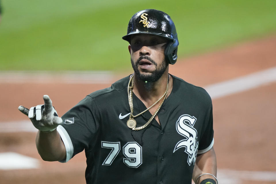 Chicago White Sox's Jose Abreu celebrates after hitting a solo home run in the sixth inning of a baseball game against the Cleveland Indians, Tuesday, Sept. 22, 2020, in Cleveland. (AP Photo/Tony Dejak)