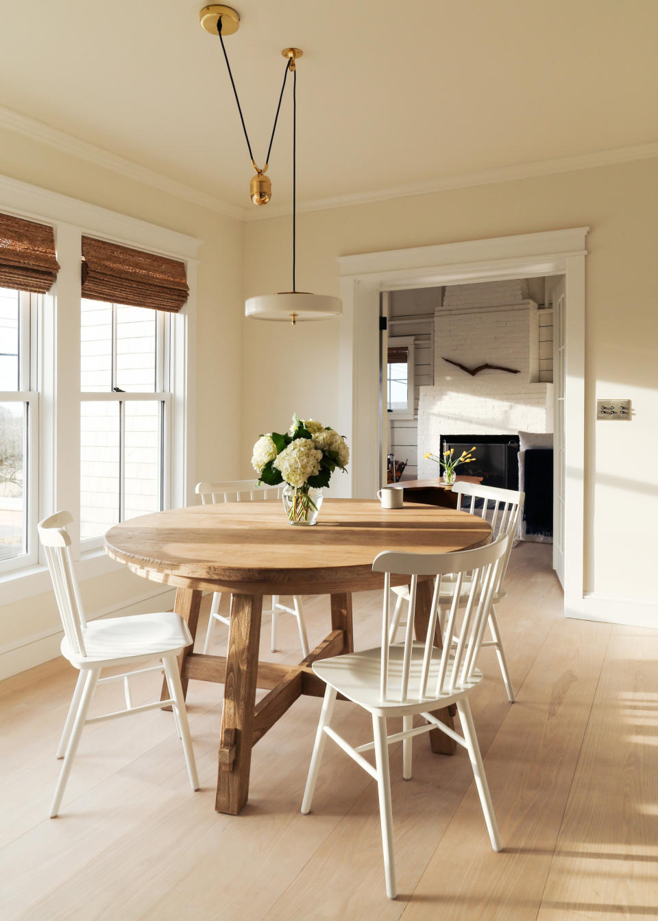 Modern cream dining room with bamboo blinds