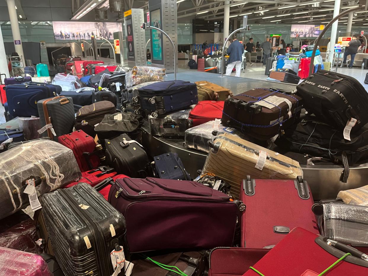 Unclaimed luggage piles up at London Heathrow Airport on July 8, 2022.