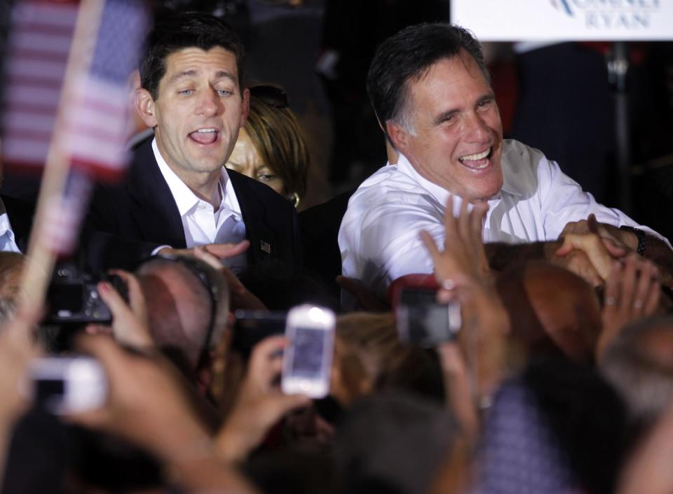 FILE - In this Aug. 11, 2012, file photo, Republican presidential candidate, former Massachusetts Gov. Mitt Romney, right, and vice presidential running mate, Rep. Paul Ryan, R-Wis., left, greet supporters, during a campaign rally in Manassas, Va. For all the attention it got, Romney’s selection of Ryan as his running mate has not altered the race against President Barack Obama. The campaign remains a dead heat with less than three months to go, a new Associated Press-GfK poll shows. (AP Photo/Pablo Martinez Monsivais, File)