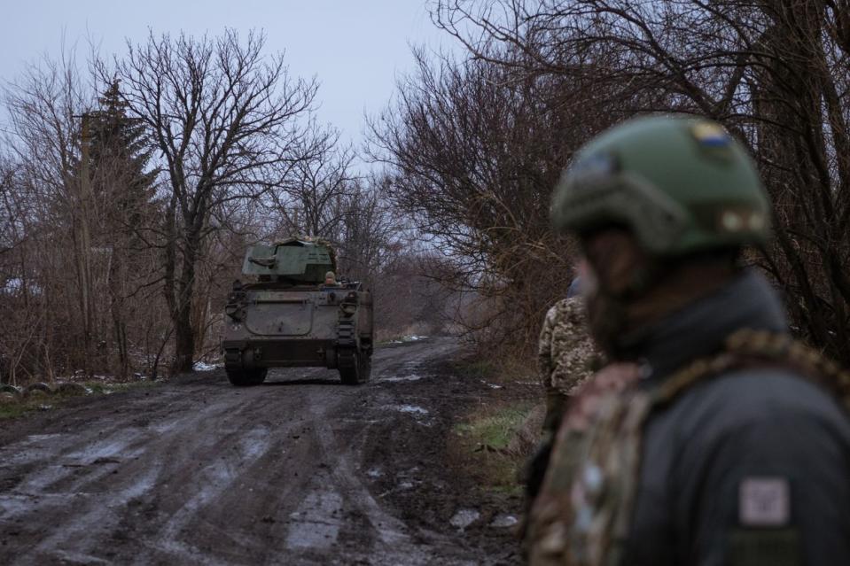 Soldiers of the 58th Mechanized Brigade of the Ukrainian army wait for a lift to position in LAV M113 as Russian attacks on the city of Vuhledar continue in Donetsk Oblast on Dec. 1, 2023. (Andre Alves/Anadolu via Getty Images)