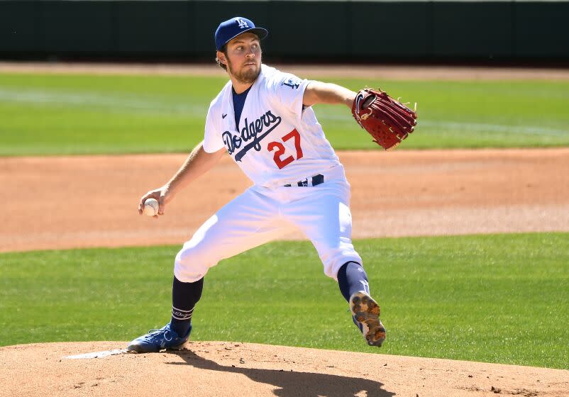 Dodgers pitcher Trevor Bauer throws a pitch against the Rockies during a spring training game in Glendale.