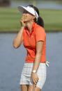 Michelle Wie reacts to winning the 2014 LPGA LOTTE Championship golf tournament on the 18th green at Ko Olina Golf Club, Saturday, April 19, 2014, in Kapolei, Hawaii. (AP Photo/Eugene Tanner)