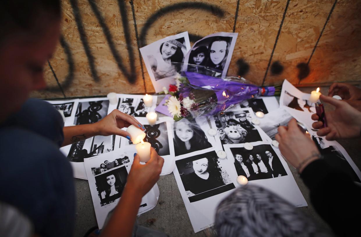 People light candles and leave photos of 18-year-old victim Reese Fallon at a memorial remembering the victims of a shooting on Sunday evening on Danforth, Ave. in Toronto on Monday, July 23, 2018. THE CANADIAN PRESS/Mark Blinch