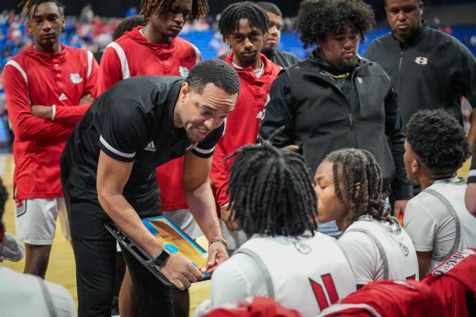 Hitchcock head coach Christopher Jordan-Foster addresses his team during a time out against San Antonio Cole in a Class 3A state semifinal on Thursday, March 7, 2024 at the Alamodome in San Antonio, Texas. Hitchcock defeated Cole 57-40. University Interscholastic League