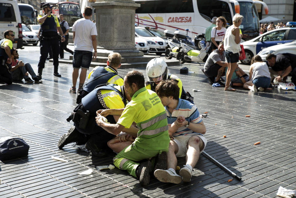 &nbsp;Medics and police tend to injured people.&nbsp;