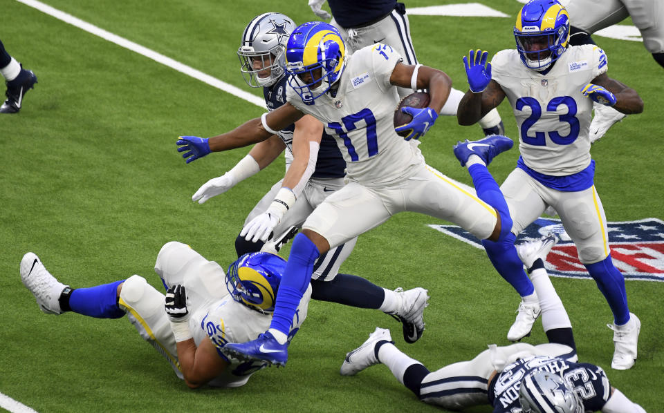 Wide receiver Robert Woods (17) of the Los Angeles Rams leaps for the first down against the Dallas Cowboys in the first half of a NFL football game on opening night at SoFi Stadium in Inglewood on Sunday, September 13, 2020. (Keith Birmingham/The Orange County Register via AP)