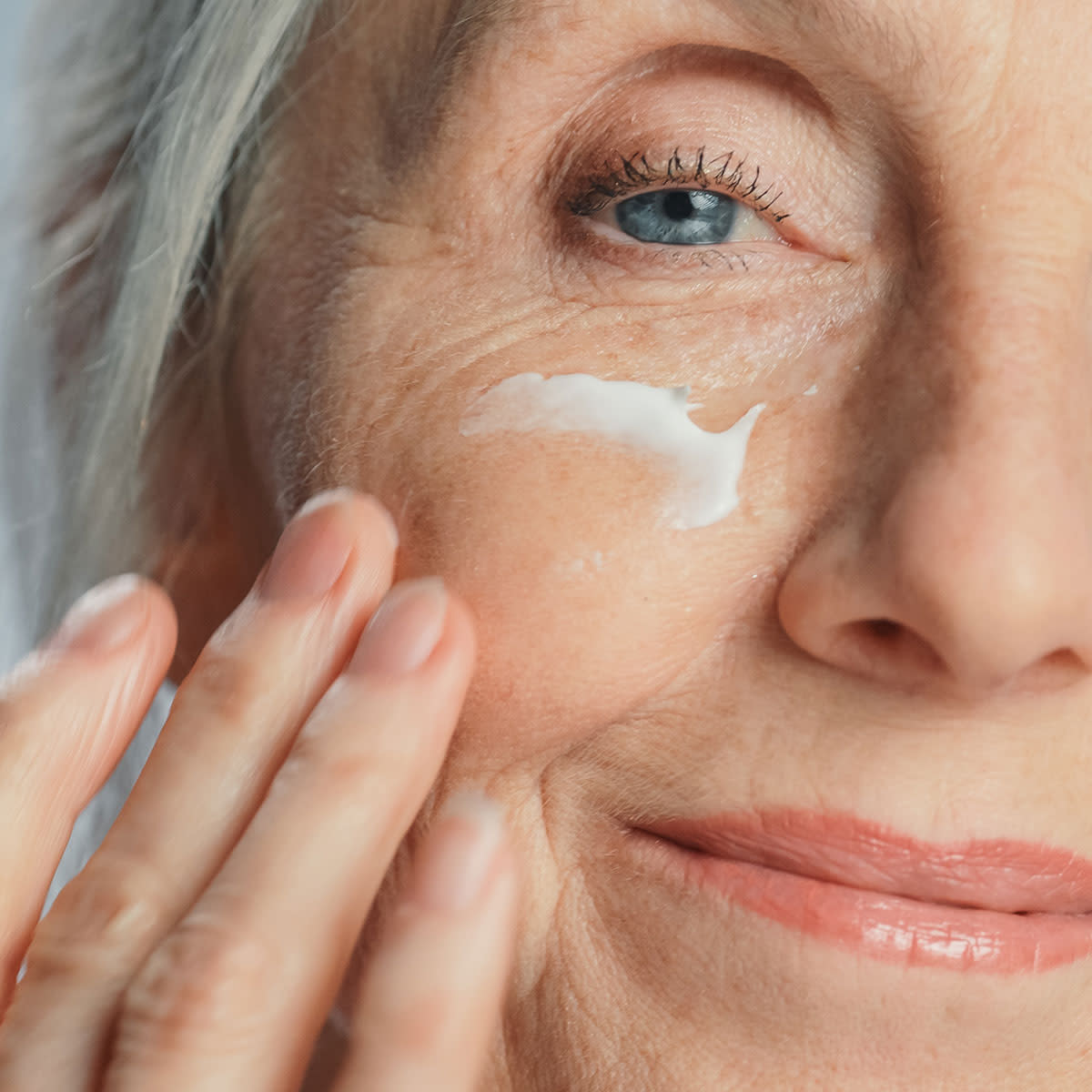 older-woman -with wrinkle-cream