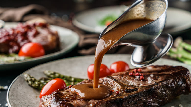 Pouring sauce on steak