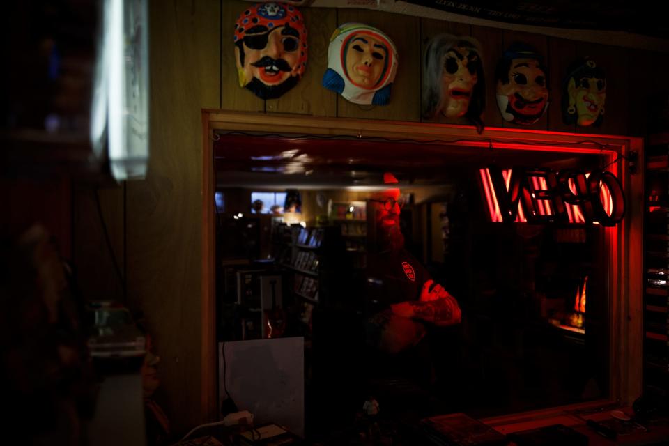 Brian Hogan poses for a portrait in his basement which he and his wife Erin have turned into a homage to the video rental stores they grew up going to on Thursday, March 11, 2021, in Urbandale, IA. 