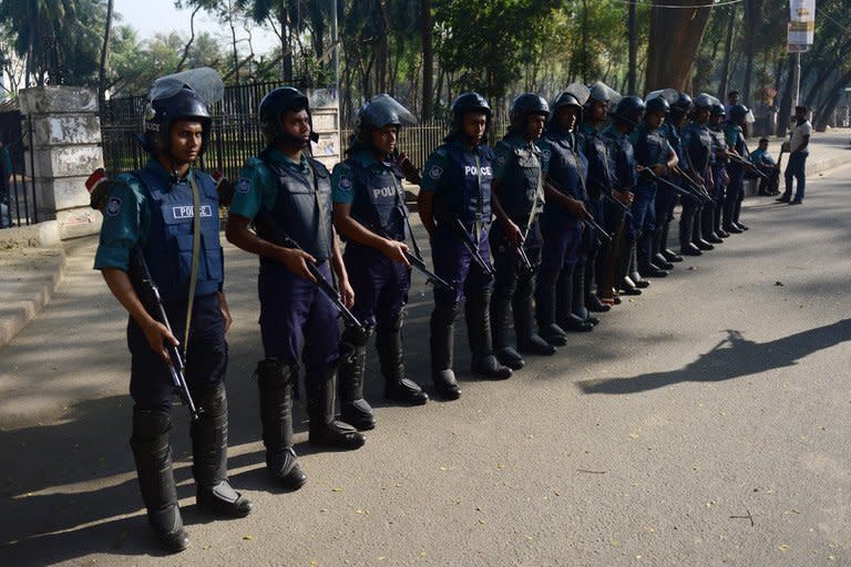 Bangladeshi police stand guard outside the International Crimes Tribunal in Dhaka, on February 28, 2013. The Bangladeshi court has sentenced a senior Islamist opposition official to death by hanging for crimes including genocide and torture during the 1971 liberation war against Pakistan