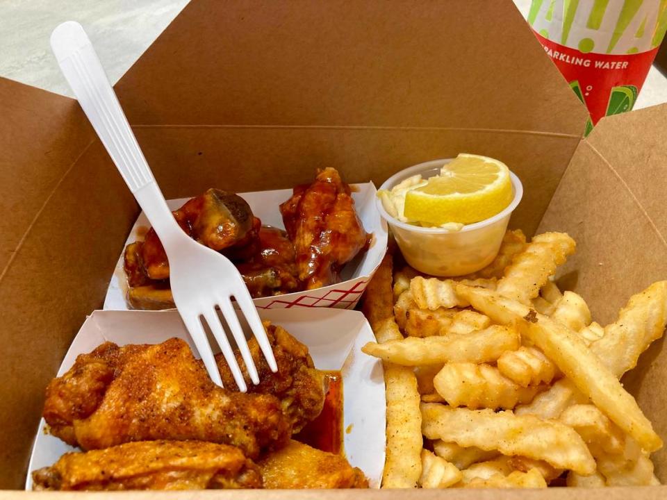 A No. 2 wings combo at No Name Chicken with Honey BBQ and Louis Louis sauces, crinkle fries and “corn slaw.”