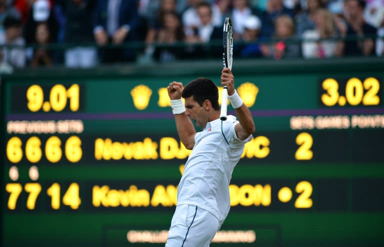 Serbia's Novak Djokovic celebrates winning the fourth set against South Africa's Kevin Anderson during their men's singles fourth round match at Wimbledon on July 6, 2015