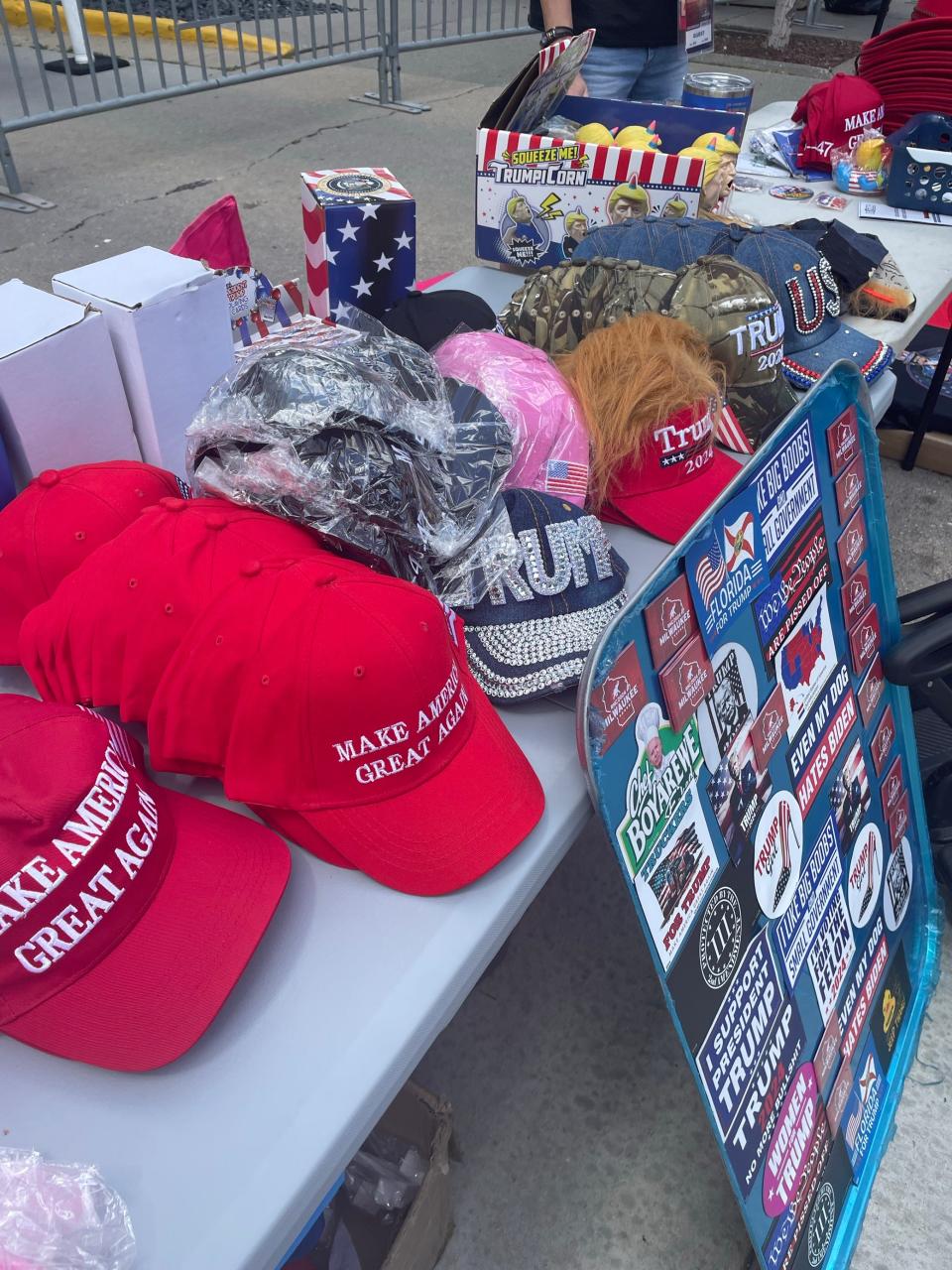 Merchandise from Leeann Joyner is for sale Wednesday, July 17, 2024, near the Hyatt Regency, 333 W. Kilbourn Ave., just outside the hard security perimeter for the Republican National Convention. Joyner lives in Orlando and travels across the country selling Trump merchandise at events.