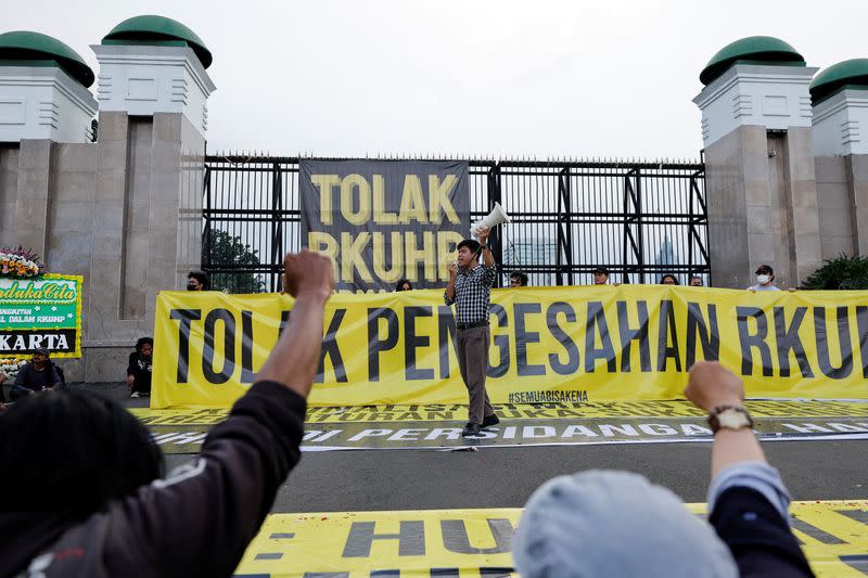 People protest against a new criminal code in Jakarta