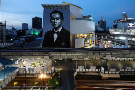 A portrait of the late King Bhumibol Adulyadej is see on the building of the Bangkok Art and Culture Centre in Bangkok, Thailand, October 6, 2017. REUTERS/Athit Perawongmetha