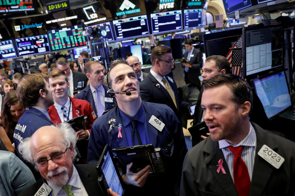 Traders work on the floor of the New York Stock Exchange (NYSE) in New York, U.S., October 12, 2018. REUTERS/Brendan McDermid