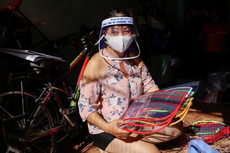 Quach My Linh, a hat vendor at Ba Chieu market, shows the face masks she makes to donate to hospitals during the outbreak of the coronavirus disease (COVID-19), in Ho Chi Minh, Vietnam