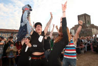 BERLIN, GERMANY - JULY 21: Members a team celebrate after winning a match of the "Skinny Jeans Tug-O-War" event at the second annual Hipster Olympics on July 21, 2012 in Berlin, Germany. With events such as the "Horn-Rimmed Glasses Throw," "Skinny Jeans Tug-O-War," "Vinyl Record Spinning Contest" and "Cloth Tote Sack Race," the Hipster Olympics both mocks and celebrates the Hipster subculture, which some critics claim could never be accurately defined and others that it never existed in the first place. The imprecise nature of determining what makes one a member means that the symptomatic elements of adherants to the group vary in each country, but the archetype of the version in Berlin, one of the more popular locations for those following its lifestyle, along with London and Brooklyn, includes a penchant for canvas tote bags, the carbonated yerba mate drink Club Mate, analogue film cameras, asymmetrical haircuts, 80s neon fashion, and, allegedly, a heavy dose of irony. To some in Berlin, members of the hipster "movement" have replaced a former unwanted identity in gentrifying neighborhoods, the Yuppie, for targets of criticism, as landlords raise rents in the areas to which they relocate, particularly the up-and-coming neighborhood of Neukoelln. (Photo by Adam Berry/Getty Images)