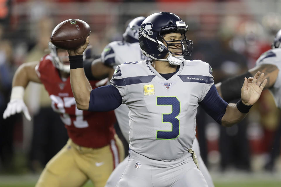 Seattle Seahawks quarterback Russell Wilson (3) passes against the San Francisco 49ers during the first half of an NFL football game in Santa Clara, Calif., Monday, Nov. 11, 2019. (AP Photo/Ben Margot)