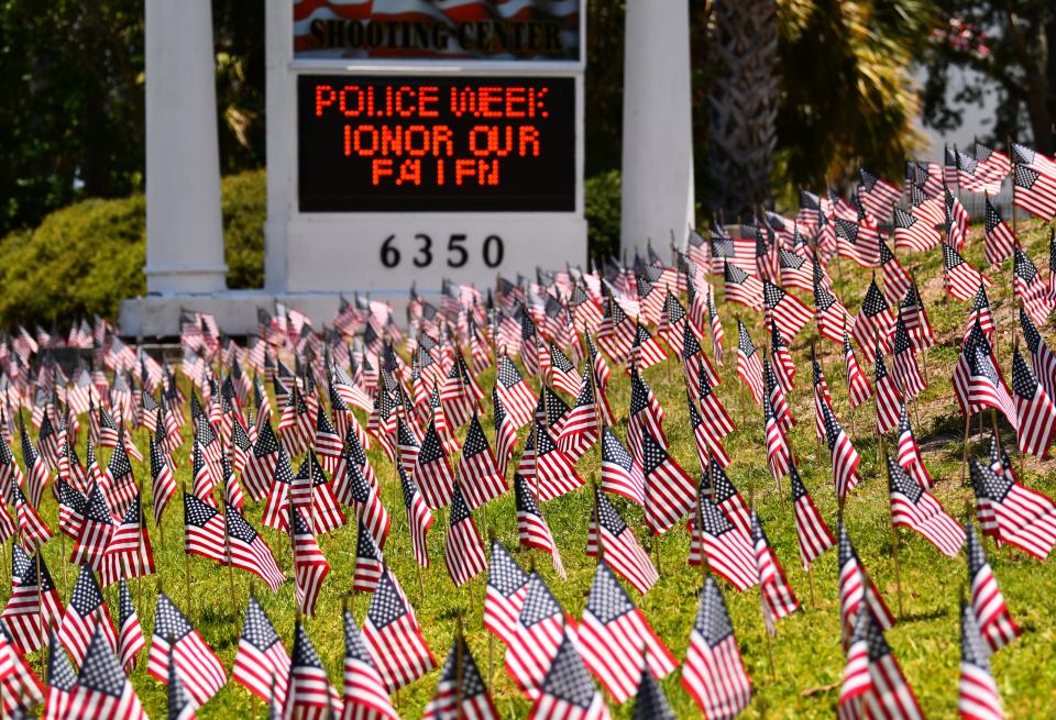 11,605 American flags surround the American Police Hall of Fame and Museum. The lawn surrounding the property is covered in flags, one for each police officer killed in the line of duty. This  is Police Week and and the law enforcement memorial event is Friday night at t7:00 p.m. at the museum.