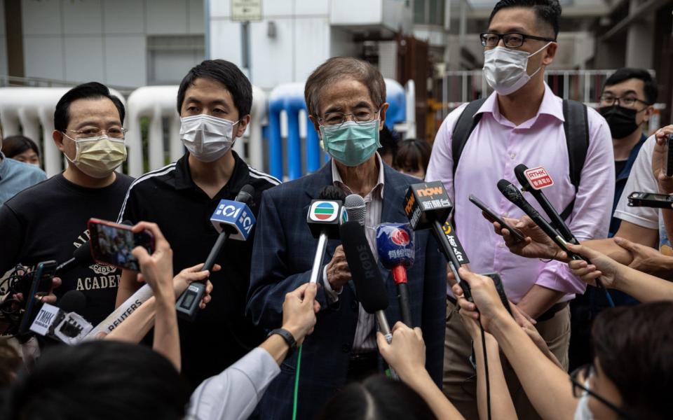 Veteran pro-democracy figure and former lawmaker Martin Lee (C) speaks to journalists after being bailed from Central Police Station in Hong Kong, following his arrest alongside other pro-democracy activists - Jerome Favre/Shutterstock