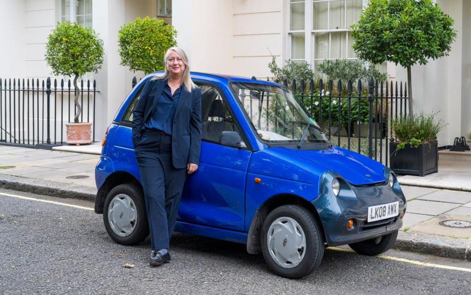 Lisa Markwell and her 15 year old G-wiz electric car