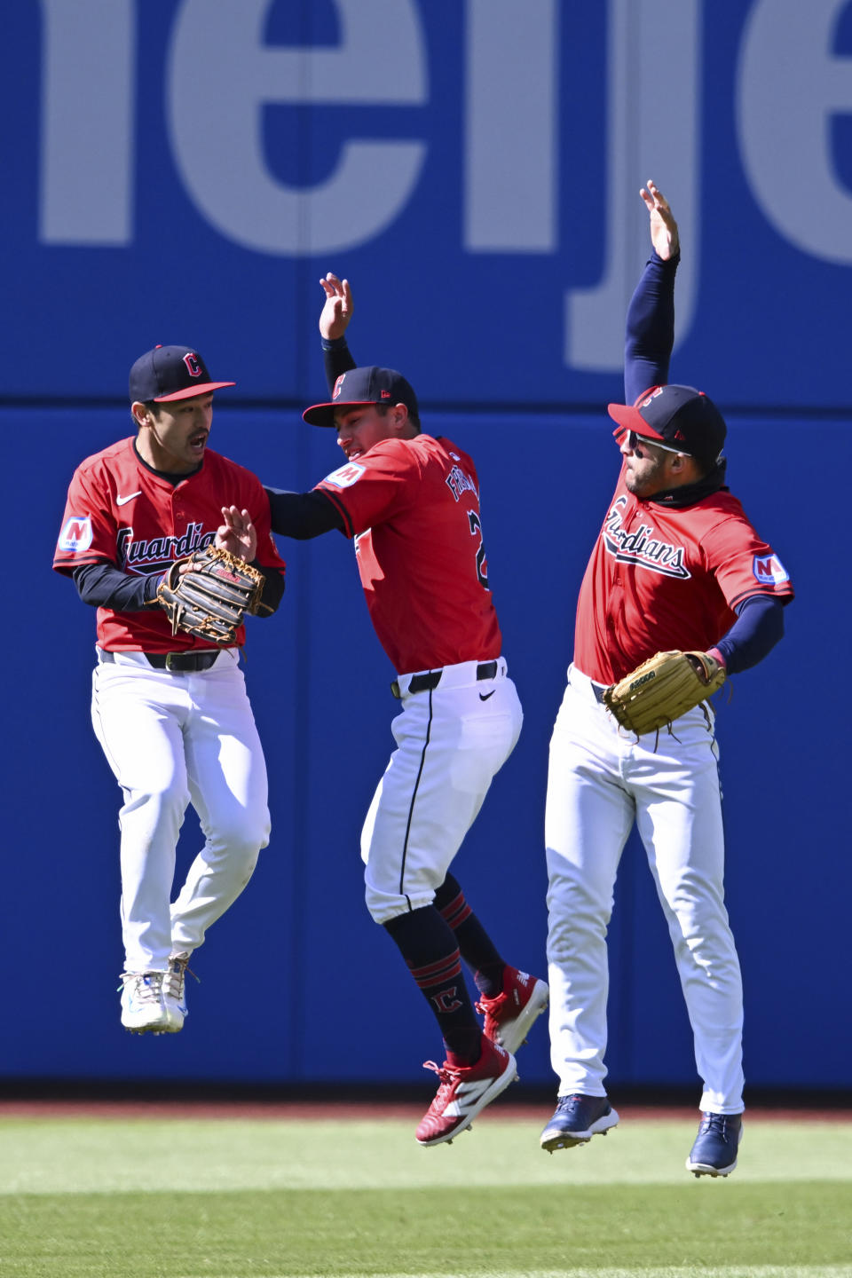 Cleveland Guardians' Steven Kwan, left, Tyler Freeman, center, and Ramón Laureano, right, celebrate after their win over the Oakland Athletics in a baseball game, Sunday, April 21, 2024, in Cleveland. (AP Photo/Nick Cammett)
