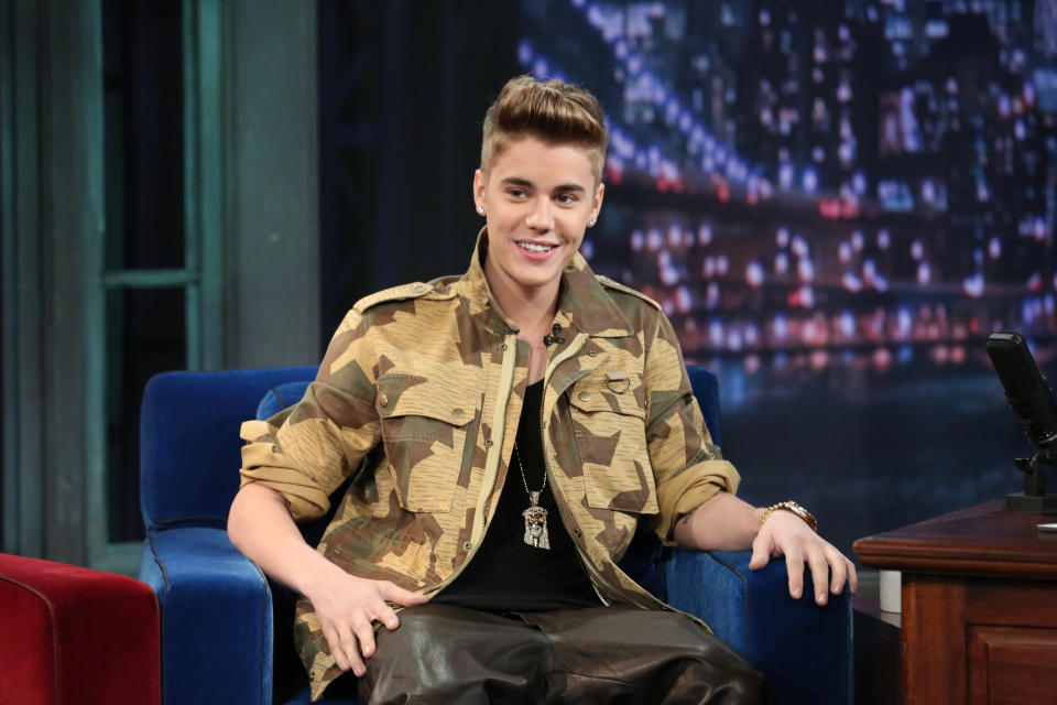 Justin in a camouflage shirt on a talk show