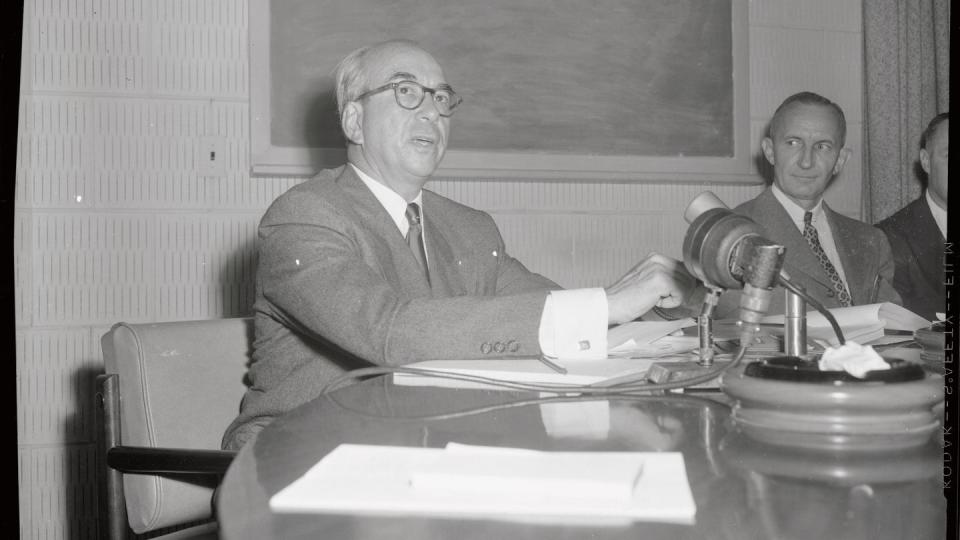 atomic energy meeting attendees at conference table