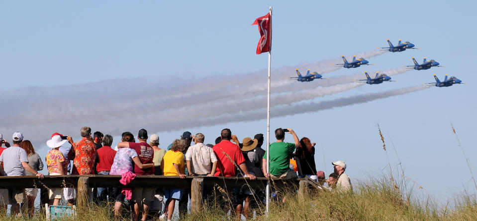 FILE - In this Oct. 21, 2012, file photo the U.S. Navy's Blue Angels fly in formation above a crowd of spectators at the Jacksonville Sea and Sky Spectacular in Jacksonville Beach, Fla. The Blue Angels and the U.S. Air Force's Thunderbirds have cancelled their 2013 seasons because of the automatic federal budget cuts causing about 60 cancellations thus far and affecting more than 200 of the approximately 300 air shows held each year. (AP Photo/Florida Times-Union, Bruce Lipsky, File)