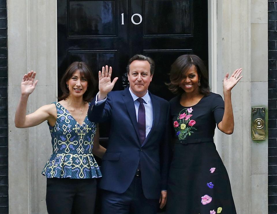 U.S. first lady Michelle Obama (R) poses with Britain's Prime Minister David Cameron and his wife Samantha at Number 10 Downing Street in London June 16, 2015. REUTERS/Darren Staples