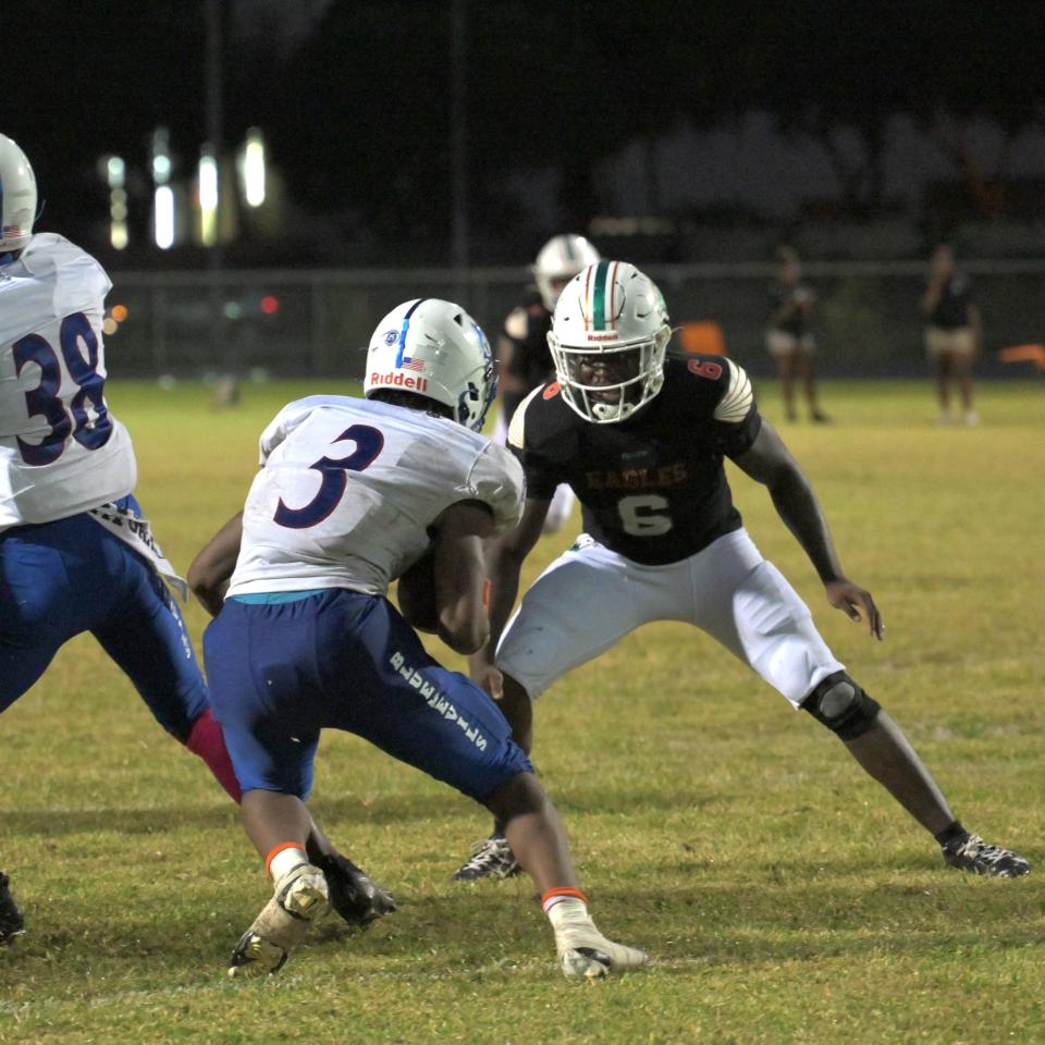 Atlantic’s senior captain Karl Luccin prepares to meet Pahokee’s Rashon Brown Jr. as the latter takes the ball out of the backfield in a regular season game on Oct. 6, 2023.