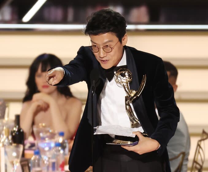 Hwang Dong-hyuk accepts the Emmy for Outstanding Directing for a Drama Series for "Squid Game ; Red Light, Green Light " during the 74th Annual Primetime Emmy Awards held at the Microsoft Theater on September 12, 2022. (Myung J. Chun / Los Angeles Times)