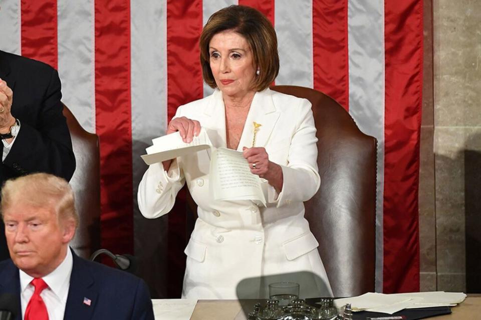 President Donald Trump in front of and House Speaker Nancy Pelosi during Tuesday's State of the Union | MANDEL NGAN/Getty Images