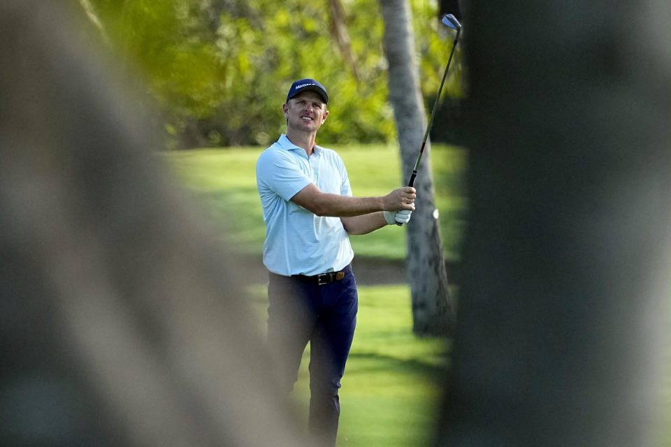 Justin Rose hits from the third fairway during the pro-am round at the Sony Open golf event, Wednesday, Jan. 10, 2024, at Waialae Country Club in Honolulu. (AP Photo/Matt York)