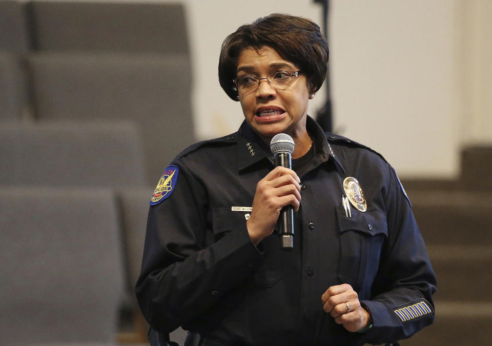 FILE - In this June 18, 2019, file photo, Phoenix Police Chief Jeri Williams addresses the audience at a community meeting in Phoenix. Two Phoenix police officers involved in separate incidents that drew national outrage have been fired. Williams announced Tuesday, Oct. 22,2019, that she notified Officer Christopher Meyer of his termination. Meyer was seen in a video drawing his gun and cursing at a pregnant woman and her fiancé in response to a shoplifting complaint. (AP Photo/Ross D. Franklin, File)