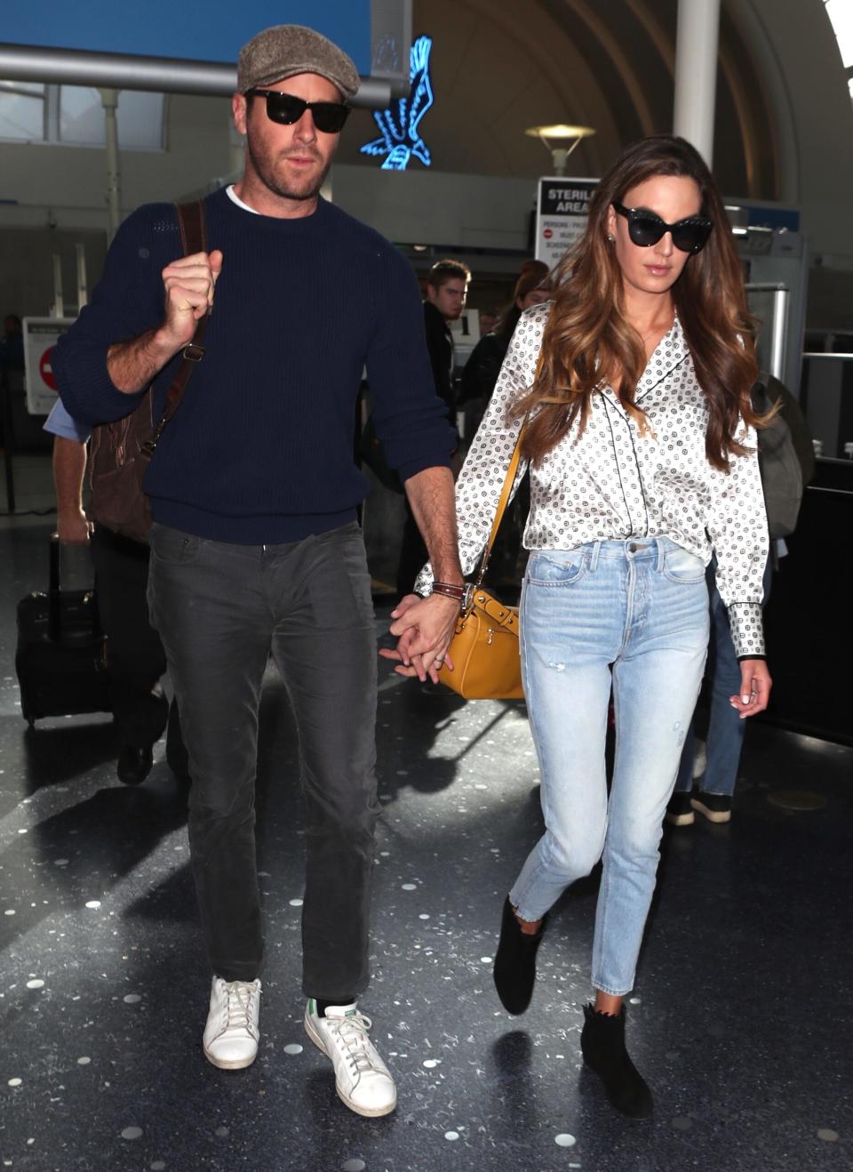 Armie Hammer arrives back to Los Angles with wife Elizabeth Chambers