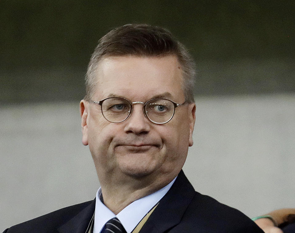 In this Sept. 9, 2018 photo the President of German soccer federation Reinhard Grindel watches friendly soccer match between Germany and Peru in Sinsheim, Germany. (AP Photo/Michael Probst)