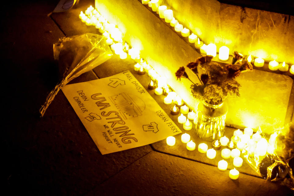 Students and community members gather for a candlelight vigil after a shooting that left three students dead the night before at the University of Virginia, Monday, Nov. 14, 2022, in Charlottesville, Va. (Shaban Athuman/Richmond Times-Dispatch via AP)